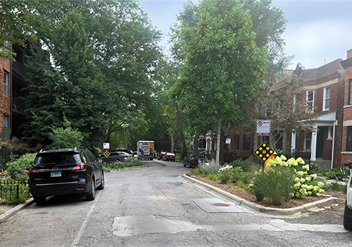 View of street with off-set parking and landscaping